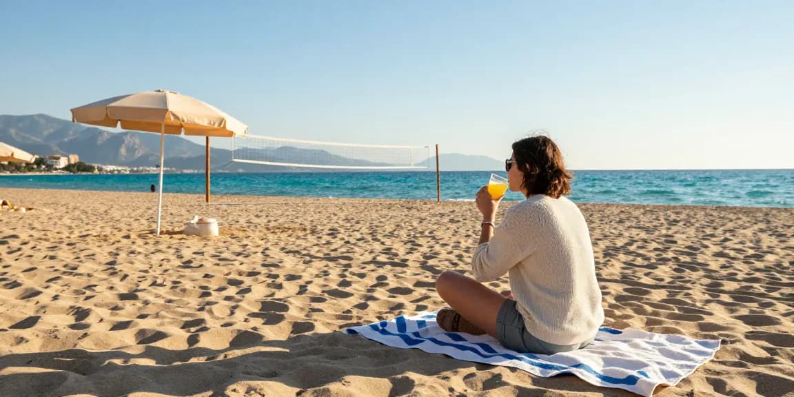 Antalya weather in November shows a traveler relaxing on the beach with warm sunshine and clear skies.